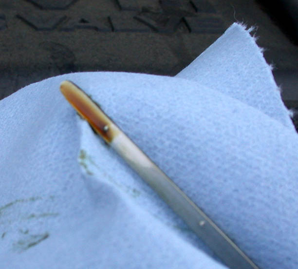 Engine oil dipstick used to check oil level